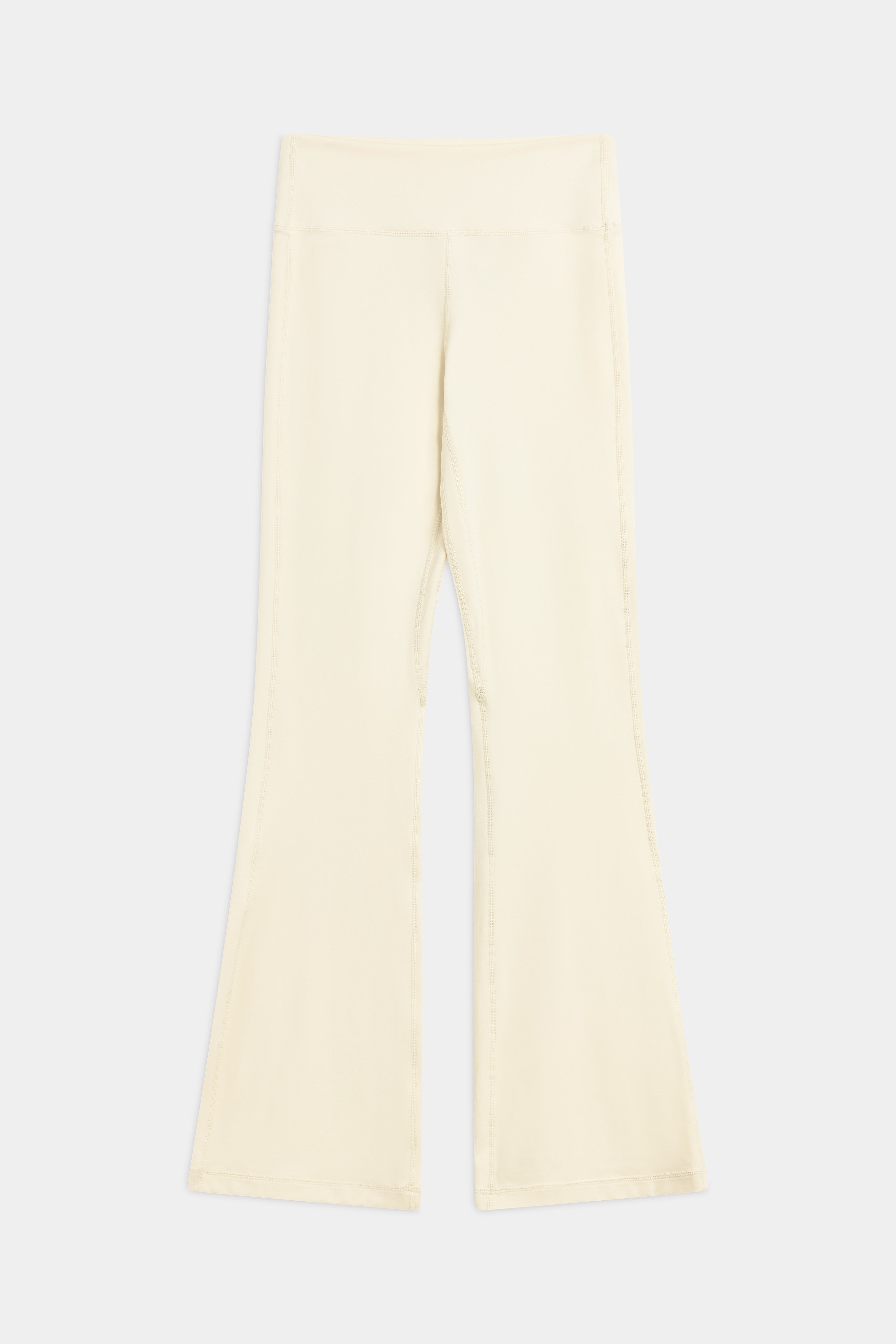 Butter yellow CASPARA Cloudform flared yoga pants shown laid flat on a neutral background.